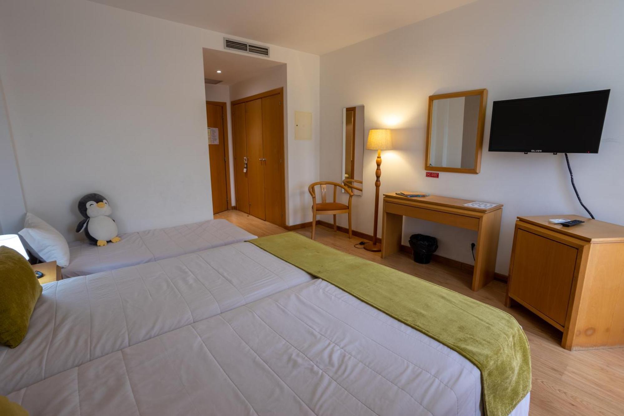 Quarto Twin com Cama Extra
