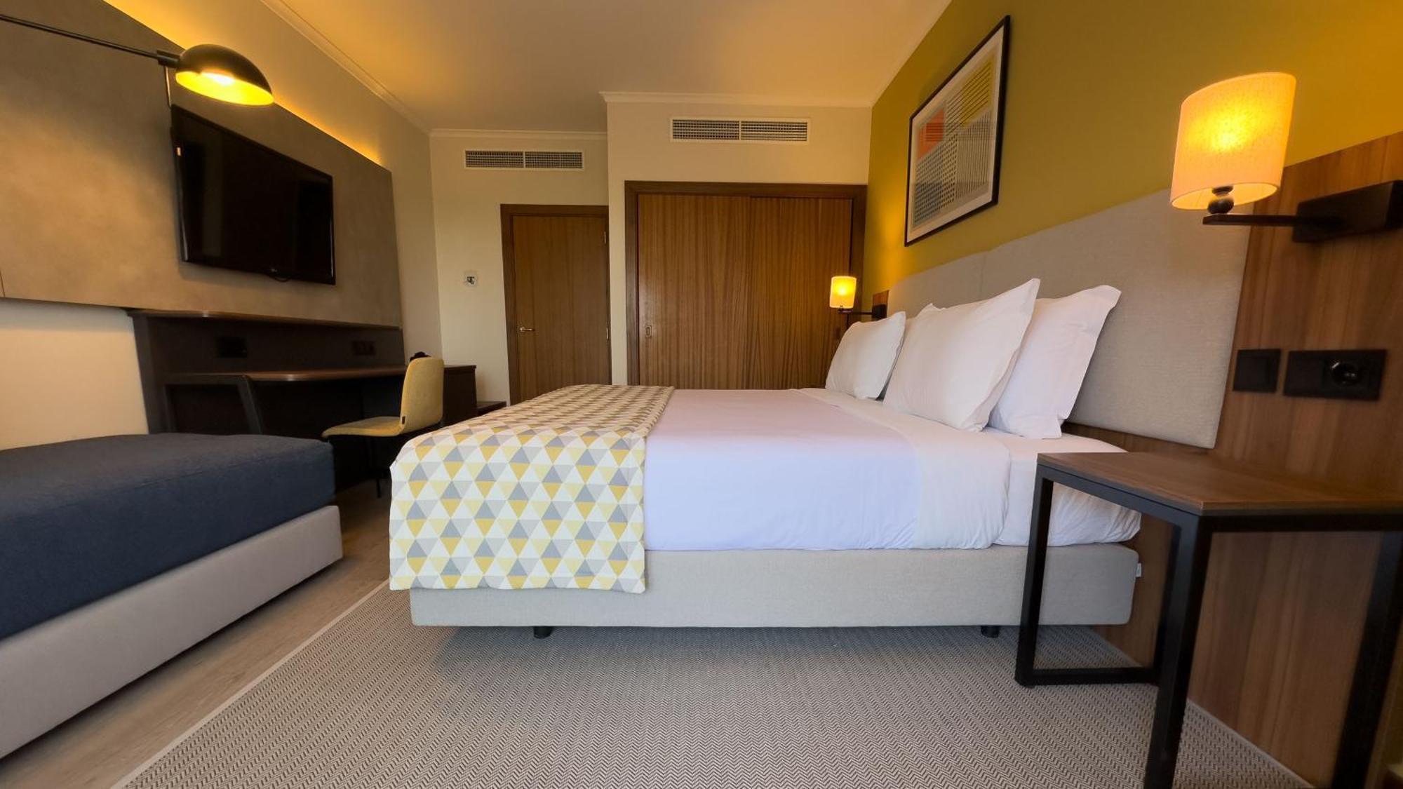 Standard Double Room with Furnished Balcony and Single Sofa Bed